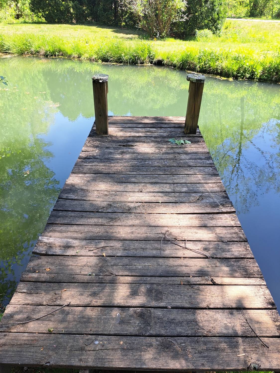 Old weathered dock with rotted boards